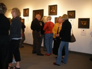 people gathered in an art gallery