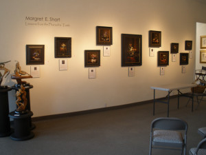 paintings hanging on wall in art gallery