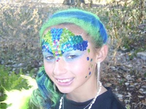 photograph of woman with face painting