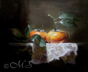 Finished painting with satmumas changed for persimmons on top of white lace doily